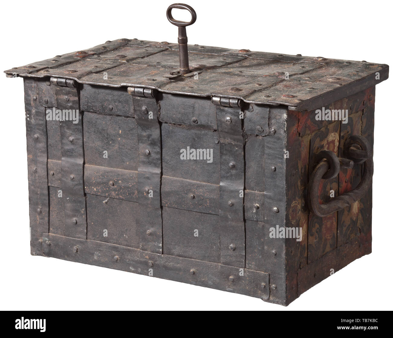 A small, polychrome German war chest, circa 1700, Rectangular body of sheet iron with wide bands. The obverse with false keyhole with chased escutcheon, beside two hasps for padlocks. Movable handle at either side. Hinged lid, the key hole with spring-loaded cover. Lock mechanism with four bolts, added hollow shank key. Cover openwork plate of tinned sheet iron decorated with acanthus leaves and bands. The obverse and both lateral fields with unusually well preserved polychrome decoration of scrolling leaves, blossoms and pomegranates. The fields, Additional-Rights-Clearance-Info-Not-Available Stock Photo