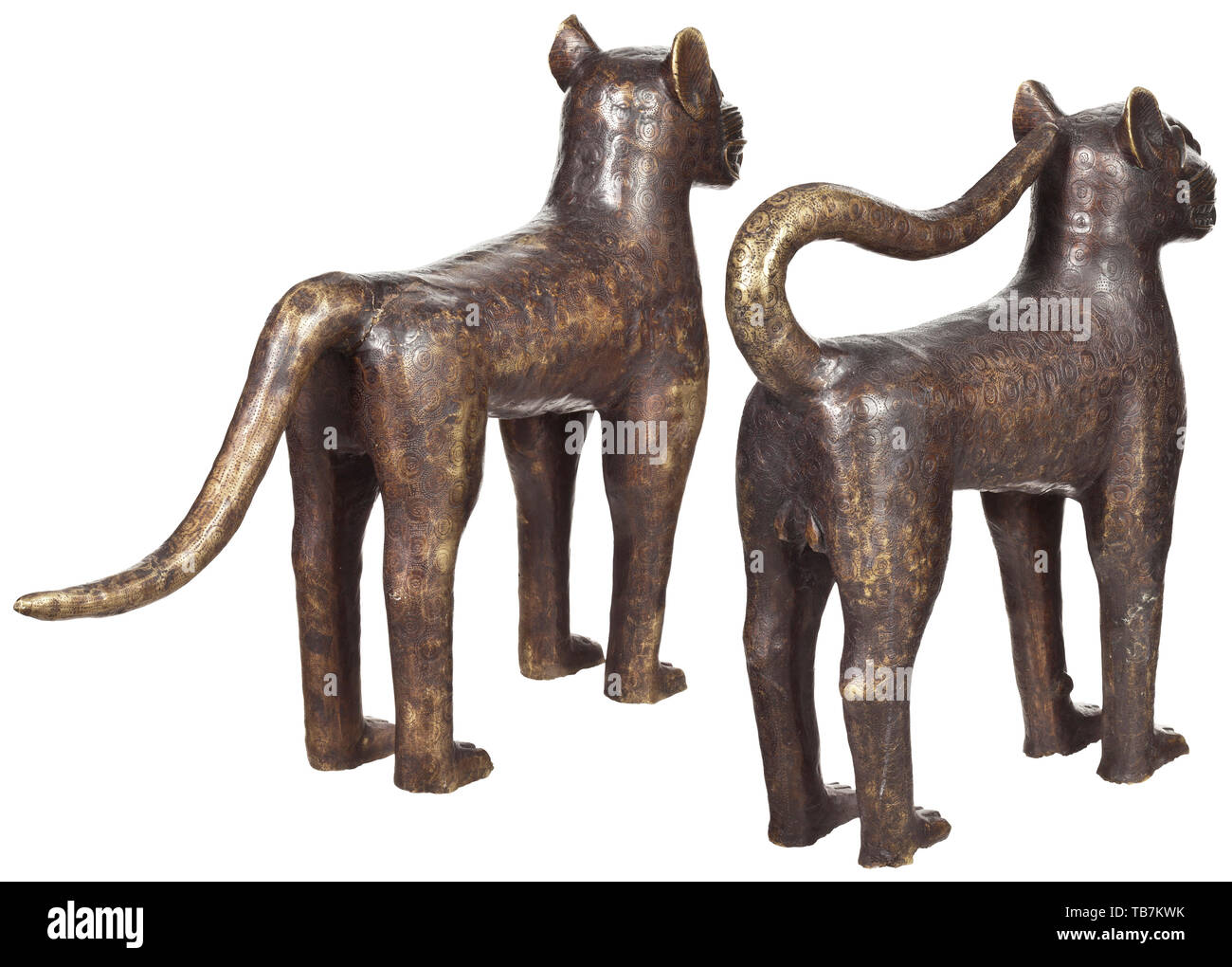 A pair of Nigerian bronze leopards, Benin, 1st half of the 20th century, Bronze cast with dark patina, slightly rubbed in places, with finely engraved surface. Depiction of a male and a female animal in typical posture. Height 59 cm and 61 cm, length 60 cm and 93 cm. Included is a thermoluminescence expertise dated 2002 which narrows the age of the sculptures to 80 years (+/- 25 years). The leopard was the symbol of the ruler, and the stories built around it were closely intertwined with the royal myths. Leopards were kept as domestic animals at , Additional-Rights-Clearance-Info-Not-Available Stock Photo