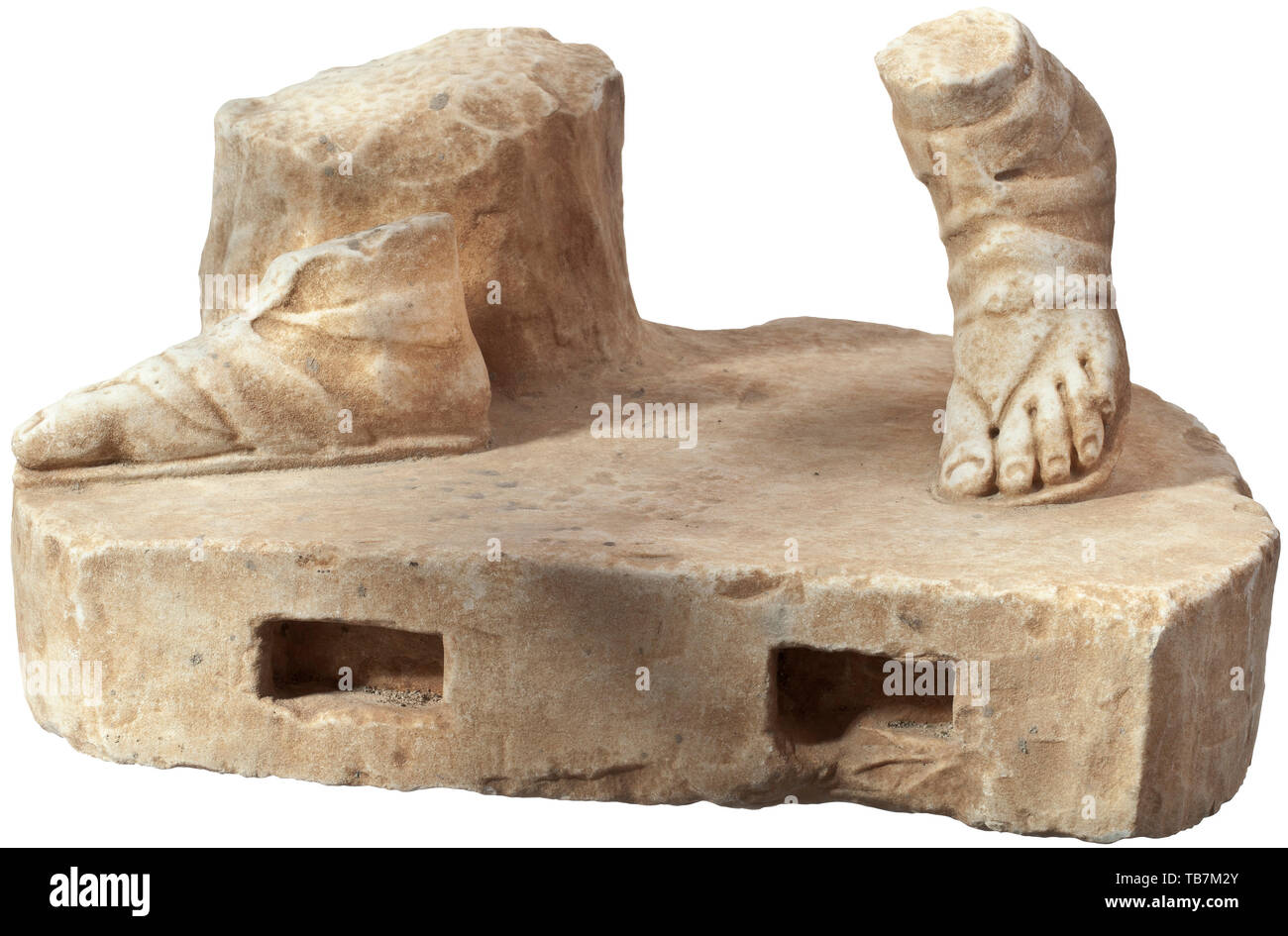 A Roman marble base with feet and tree stump of a statue of Apollo, 1st - 2nd century, Base plate of 7 cm height, the lateral surfaces straight at the front with two rectangular connecting holes and rounded at the back. On the base two sandal-clad feet of a figure striding to the left in front of a tree stump, their posture corresponding to a Roman copy reminding of the statue of Apollo (Apollo Belvedere) attributed to the Hellenistic sculptor Leochares. Minimal attritions and knocks on the surface. Width 39 cm, height 22 cm. Provenance: Polish p, Additional-Rights-Clearance-Info-Not-Available Stock Photo