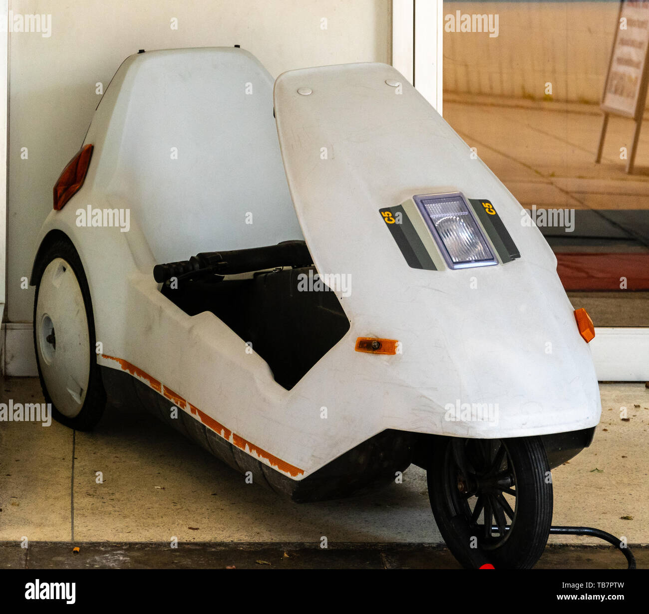 Swindon, United Kingdom - May 04 2019:   A Sinclair C5 electric trike outside the Museum of Computing on Regent Circus Stock Photo