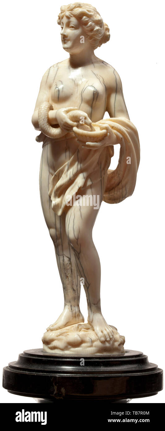 A German Asclepius and Hygieia, 17th/18th century, A pair of finely carved, fully sculptured ivory figures. Antique-like depiction of the Greek god of medicine and healing, his right arm supported on a staff entwined with a serpent (rod of Asclepius). The figure of Hygieia, goddess of health and daughter of Asclepius, is portrayed with a snake and a bowl. Each statuette on an oval plinth. The figure of Hygieia with a restored crack at the ankle, damage to the tail of the snake. The figure of Asclepius with a small defect on the right biceps. On t, Additional-Rights-Clearance-Info-Not-Available Stock Photo