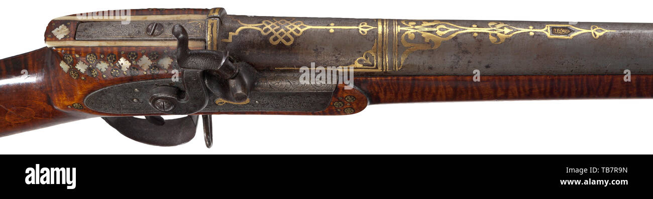 A Persian, gold-inlaid percussion rifle, 19th century, Round, rifled  Damascus barrel in 17 mm calibre with cannon muzzle. The surface of the  barrel inlaid with knotted ribbon ornaments and arabesques in gold.