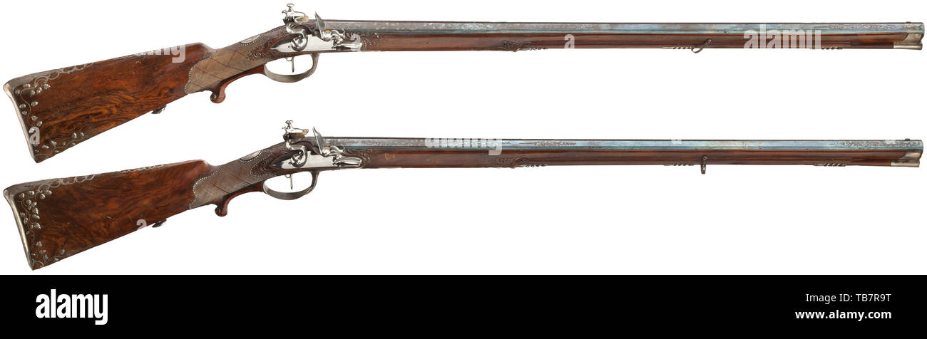 King Friedrich I of Württemberg - a pair of flintlock shotguns, by Christian Körber in Ingelfingen, circa 1810, Octagonal, blued and richly silver inlaid smooth barrels in 15 mm calibre, gold-lined vent holes, signed at top. Fine flint locks polished on the in 19th century, Additional-Rights-Clearance-Info-Not-Available Stock Photo