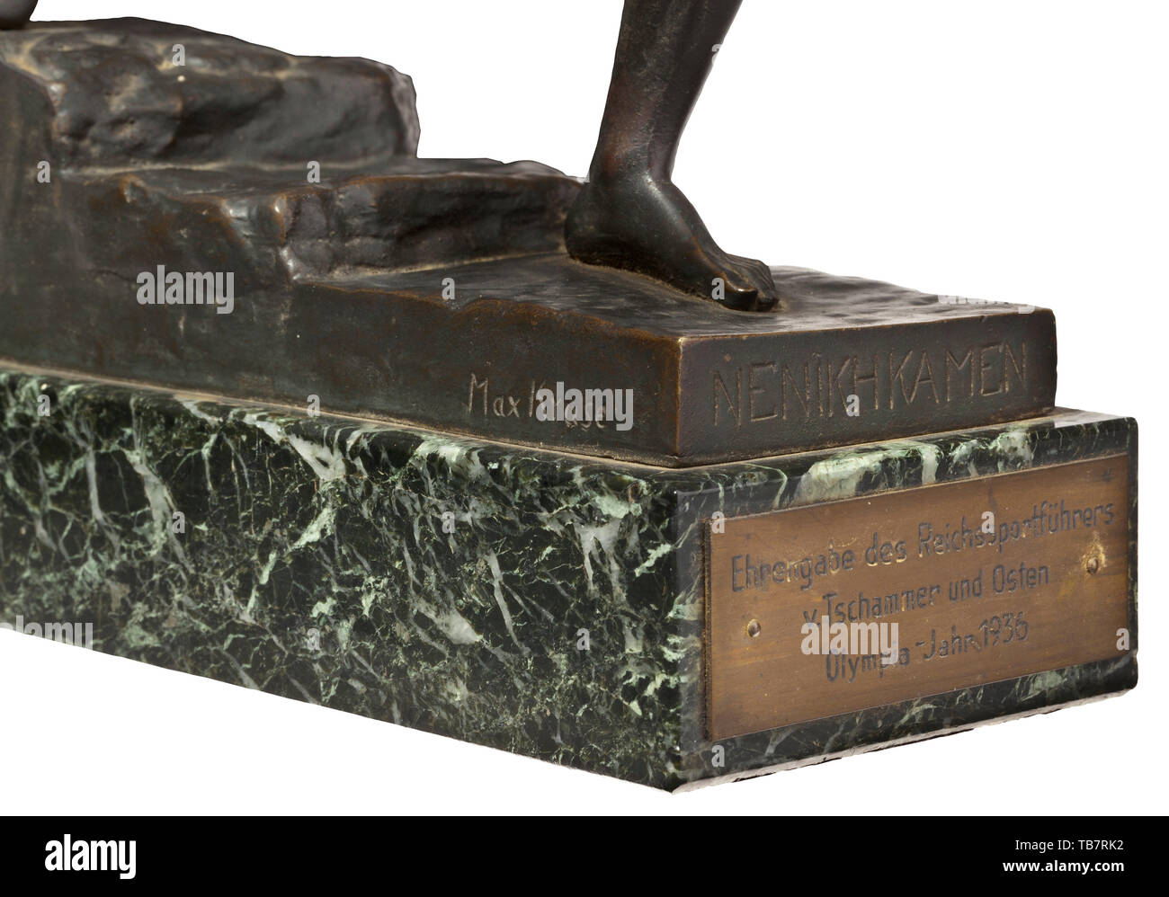 Max Kruse (1854 - 1942) - The Messenger of Marathon, honorary endowment from the Reichssportführer von Tschammer und Osten for the Olympic Games 1936, Bronze, black-brown patinated (rubbed, laurel branch missing), the base with the artist's signature and inscription 'NENIKHKAMEN' and foundry signature 'Gladenbeck GmbH', on green marble base with dedication plaque (tr.) 'Honorary Endowment from the Reichssportführer v. Tschammer und Osten / Olympia Year 1936' (height ca. 37 cm). With a black and white photograph in old frame, handwritten on the mo, Additional-Rights-Clearance-Info-Not-Available Stock Photo