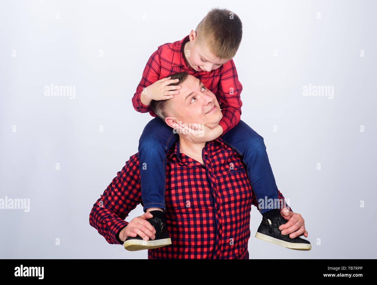 Spending carefree time. father and son in red checkered shirt. little boy  with dad man. fathers day. happy family. childhood. parenting. Family is  the most important thing. My funny friend Stock Photo -