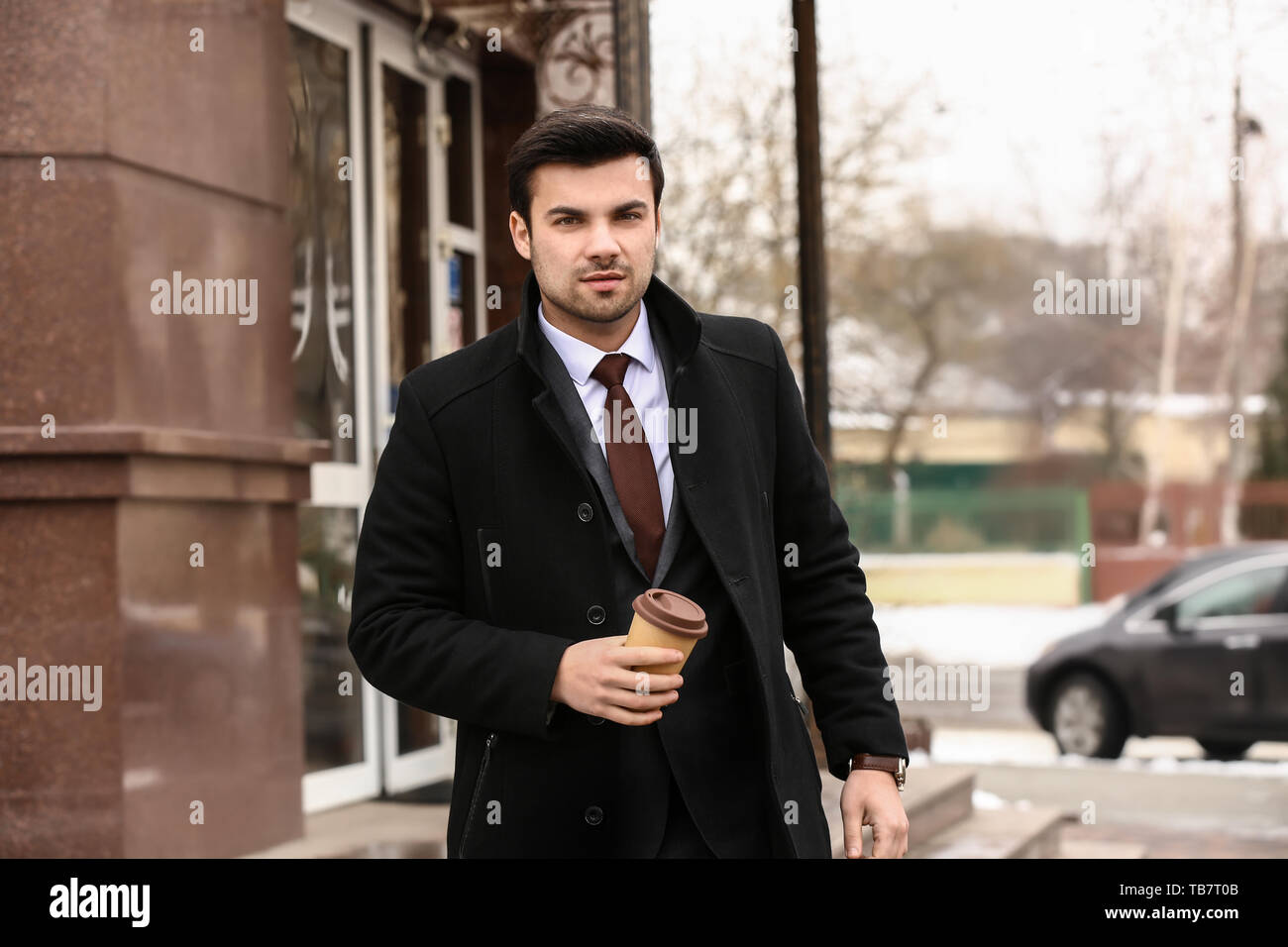 Portrait of handsome young businessman outdoors Stock Photo - Alamy