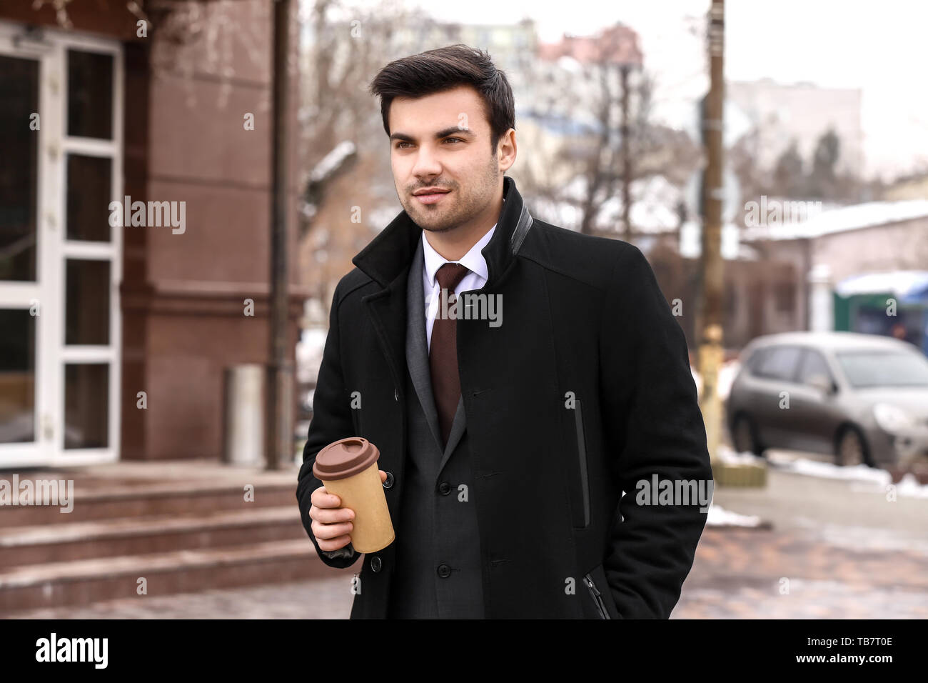 Portrait of handsome young businessman outdoors Stock Photo - Alamy