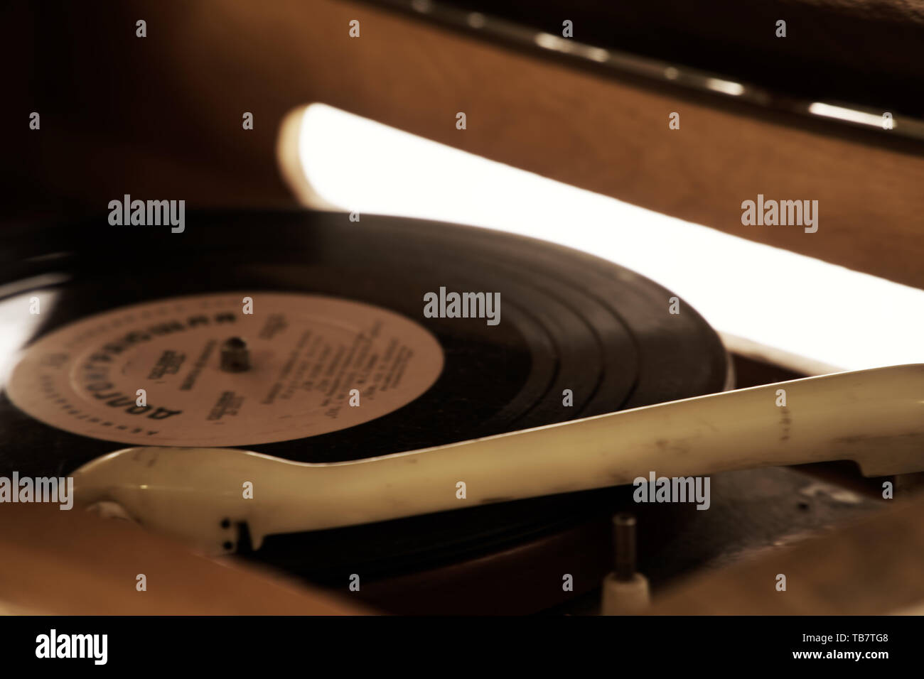 Turntable, Old record player stylus on a rotating disc, vintage filtered, selective focus Stock