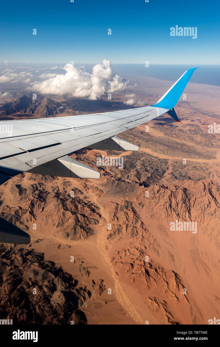 Aerial view of the Sahara desert between the river Nile and the Red Sea with an aircraft wing, Egypt, Africa. Stock Photo