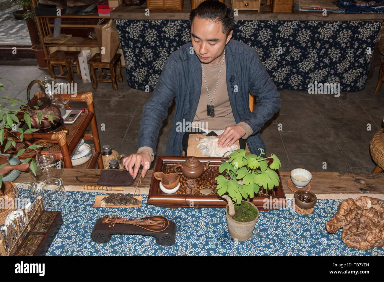Chinese Tea Ceremony. Male server prepares the traditional tea. photographed in Chengdu, Sichuan, China Stock Photo