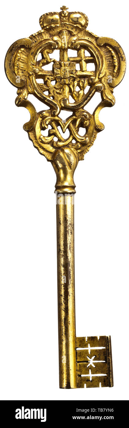 A historic chamberlain's key, bearing the cypher of Maximilian Franz of Austria, Archbishop of Cologne and Prince Elector of Hapsburg-Lorraine, together with the arms of the Teutonic Order, of which he was Grand Master, circa 1784 - 1801, Of gilt bronze, cast in low relief, the top formed as a rococo cartouche surmounted by an archducal crown, pierced with the quartered arms of the Archduke Maximilian Franz, the in-escutcheon charged with the 'bindenschild' on one side and with the arms of the Teutonic Order on the reverse, and with the cypher of, Additional-Rights-Clearance-Info-Not-Available Stock Photo