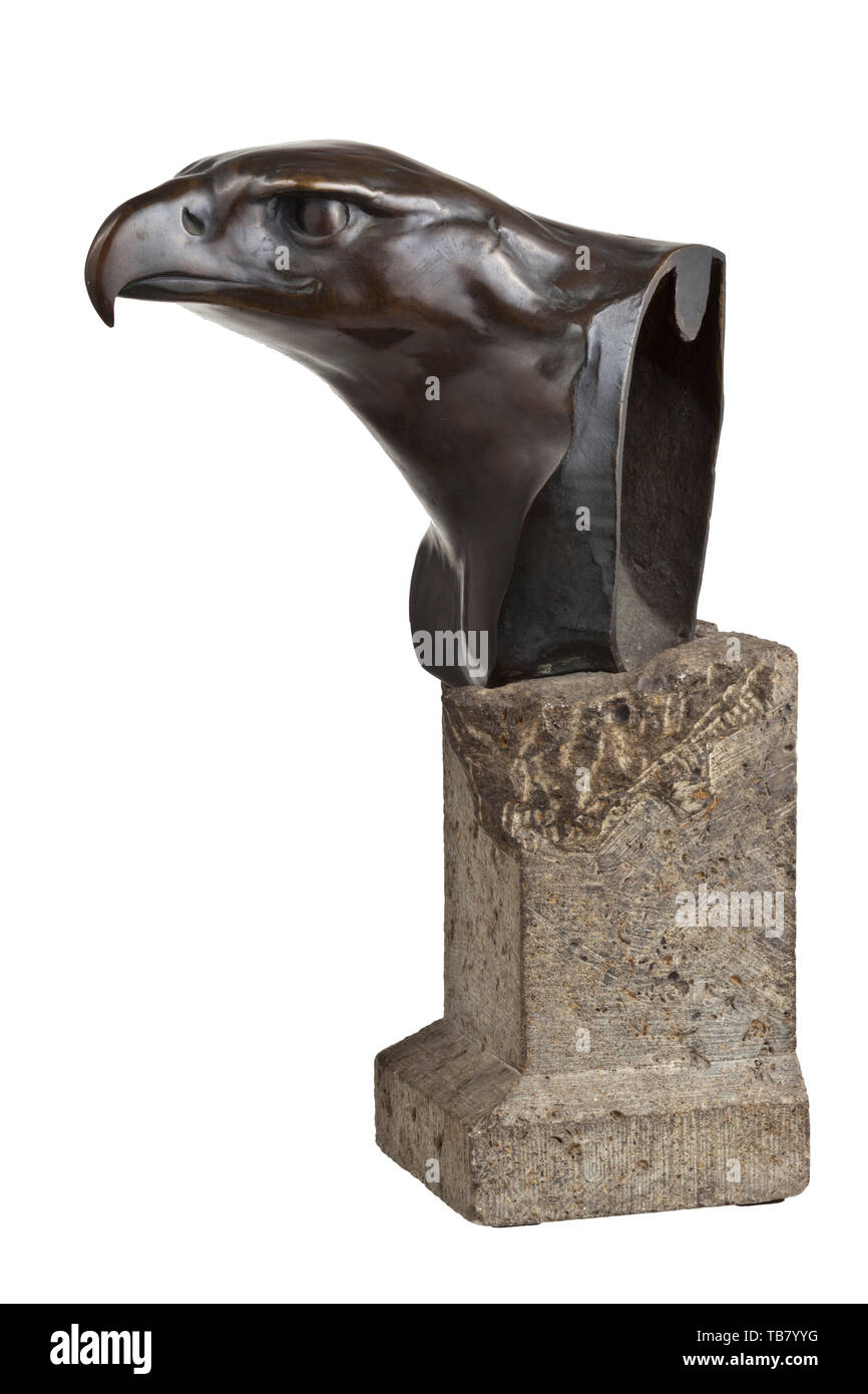 A statue of an eagle, Bronze, hollow cast, brown patina, signed by the artist at the bottom left and dated 'Vordermag 1920'. Mounted on a grey stone pedestal (chipped). Height circa 40 cm. A very prestigious sculpture. historic, historical 20th century, Editorial-Use-Only Stock Photo