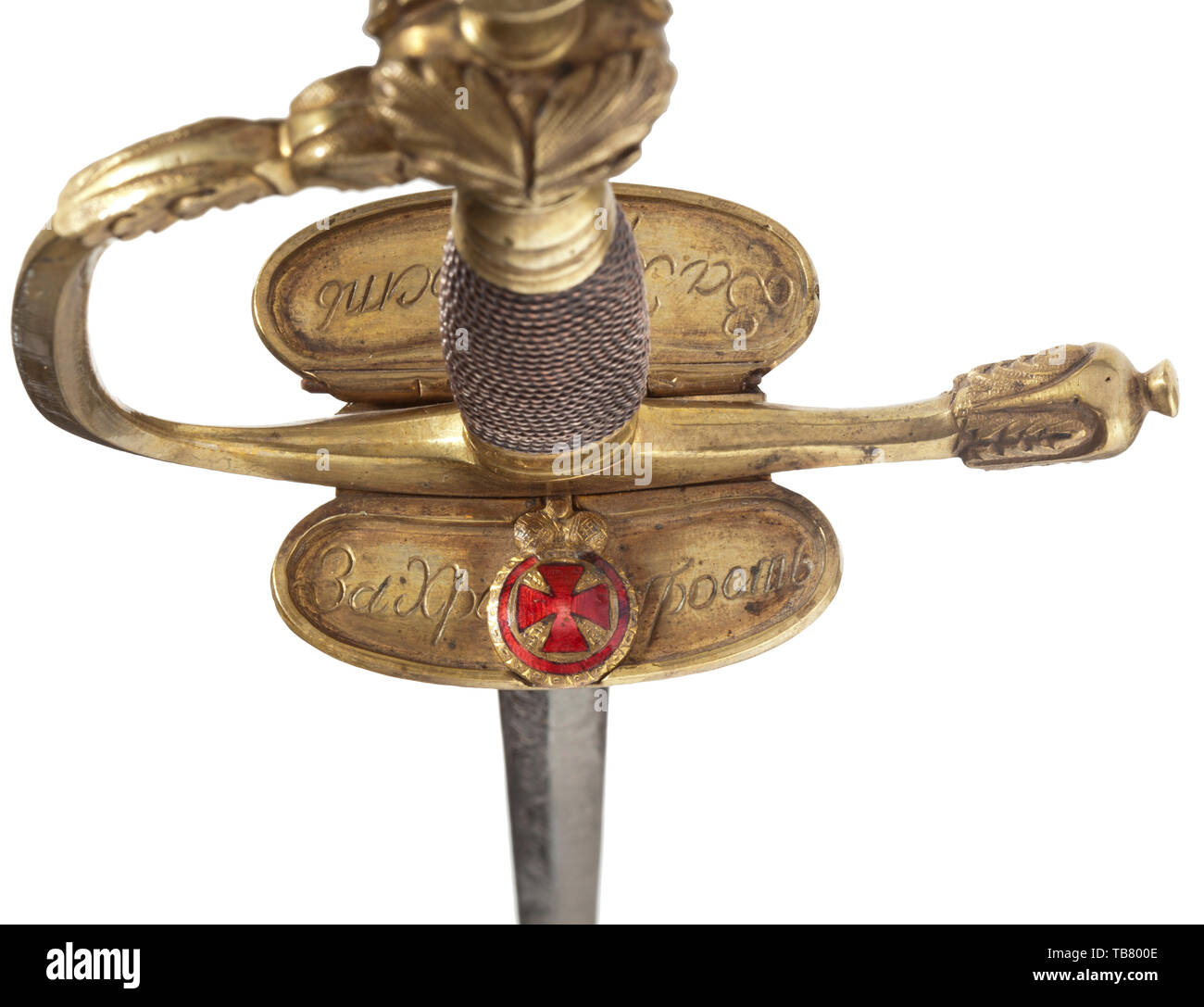 A small-sword M 1798 for bravery with applied Order of St. Anne for Russian infantry officers, Slender, double-edged thrusting blade. Etched trophies with floral decoration on both sides. On ricasso maker's mark 'E.& F. Hörster Solingen'. Hilt with floral décor and brass wire winding, remnants of gold-plating. On insides of guard plates engraved Cyrillic inscriptions 'For Bravery' as well as applied miniature of the Order of St. Anne. Leather-covered wooden scabbard with brass mountings. Length 90 cm. historic, historical, Additional-Rights-Clearance-Info-Not-Available Stock Photo
