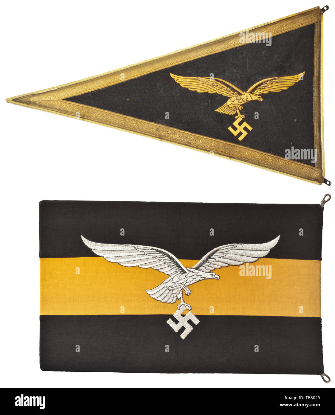 A vehicle standard for a general in the Luftwaffe, On both sides a yellow arrased Luftwaffe eagle, outlined in brown on dark grey cloth, a border of gold braid with a swastika motif, celluloid cover (a few small cracks). Dimensions circa 26 x 45 cm. Includes another standard for a commanding officer in the Luftwaffe, on both sides a woven white Luftwaffe eagle, outlined in grey on grey-yellow-grey cloth. Dimensions circa 26 x 40 cm. Slight signs of age and use. Rare standards in superb condition. historic, historical 20th century, Editorial-Use-Only Stock Photo
