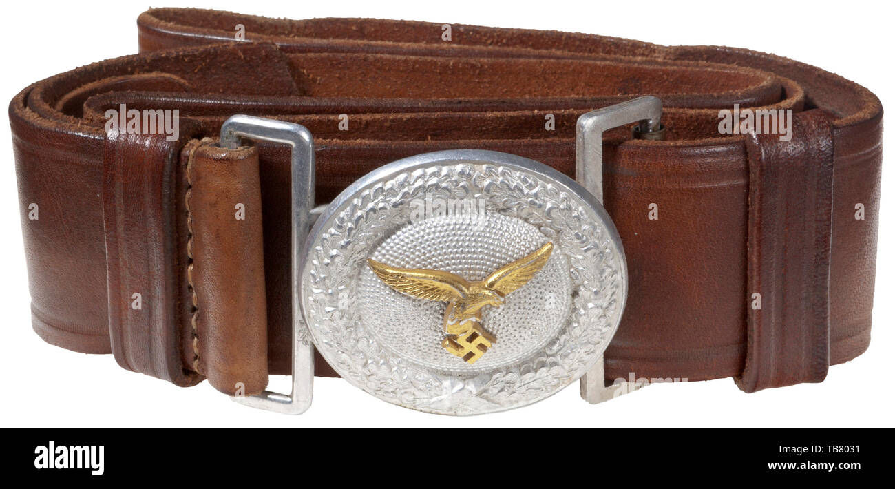THE JOHN WAHL BELT AND BUCKLE COLLECTION, A Luftwaffe Officer Leather Belt and Buckle, Stamped aluminium 50 x 55 mm oval buckle, reverse stamped with Overhoff & Cie, manufacturer's logo 'OLC' in a diamond. 45 mm brown leather belt with two sliding, vertical 15 mm brown leather keepers and aluminium catch. Brown leather size adjustment tongue unmarked. Length approx. 95 mm., Editorial-Use-Only Stock Photo