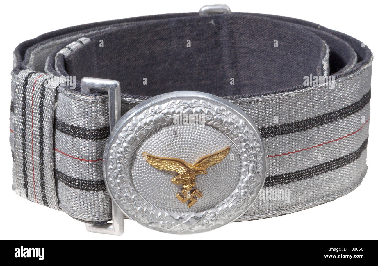 THE JOHN WAHL BELT AND BUCKLE COLLECTION, A Luftwaffe Officer Brocade Belt and Buckle, Stamped aluminium 50 x 55 mm oval buckle with gilded aluminium 2nd pattern eagle attached by three rivets, reverse stamped with Assmann manufacturer's logo 'A' and a penciled number '105'. 45 mm blue/grey gabardine backed silver/aluminium woven brocade, with two blue outer stripes and one centre red stripe. Two sliding, vertical 22 mm matching keepers and an aluminium catch. Length approx. 105 cm., Editorial-Use-Only Stock Photo