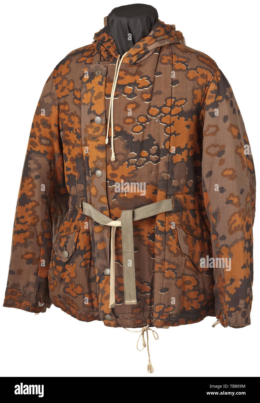 A reversible winter jacket in oak leaf camouflage pattern, Reversible from the white winter side to the autumn side in brown oak leaf camouflage, the thick padded 'heavy' issue with field-grey uniform buttons and white paperboard buttons. The white side somewhat soiled with a large patch of discolouration. Both sides with the same features, double-breasted with inner and outer closable button fly and supplement cover strip, the lower sleeves reinforced, two hip pockets with closure flaps, woven belts inserted at the waist and cuffs, a large hood designed to fit over the ste, Editorial-Use-Only Stock Photo