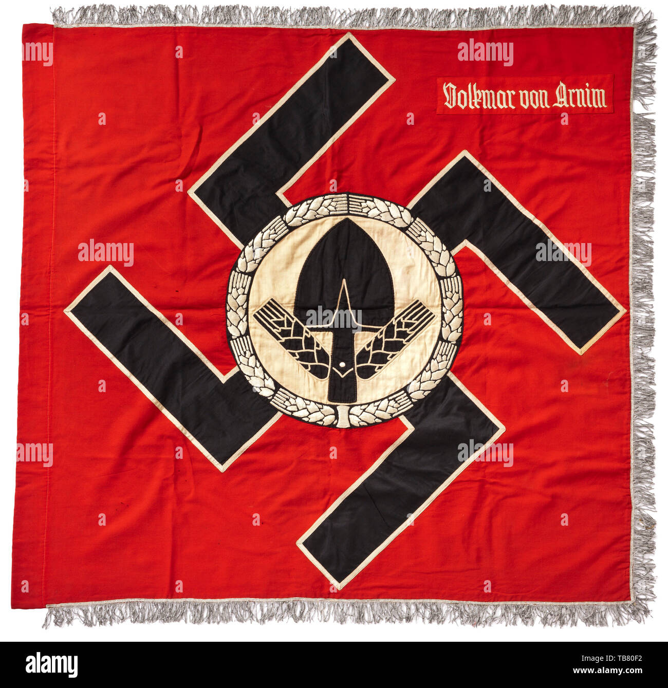A flag of RAD Battalion Volkmar von Arnim, Thick, red flag cloth with three-sided silver fringe, both sides with a sewn-on black swastika with white edging on which is a white circle with a black RAD emblem enclosed by a white, hand-embroidered wreath of grain. Both sides with a light red flag patch and hand-embroidered white unit designation. Damaged in places, signs of age. Dimensions circa 120 x 110 cm. A beautiful, richly embroidered example. historic, historical 20th century, Editorial-Use-Only Stock Photo