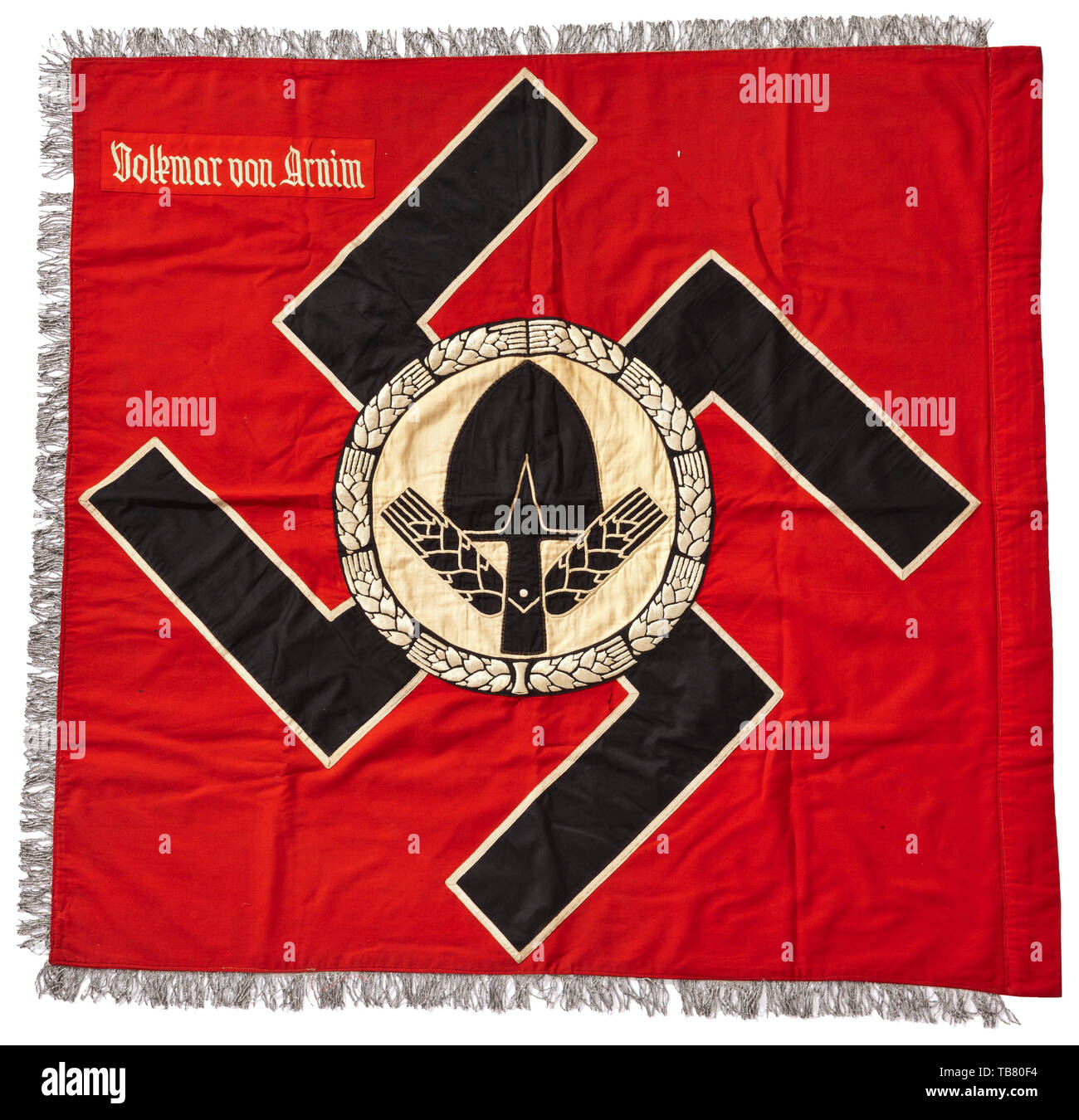 A flag of RAD Battalion Volkmar von Arnim, Thick, red flag cloth with three-sided silver fringe, both sides with a sewn-on black swastika with white edging on which is a white circle with a black RAD emblem enclosed by a white, hand-embroidered wreath of grain. Both sides with a light red flag patch and hand-embroidered white unit designation. Damaged in places, signs of age. Dimensions circa 120 x 110 cm. A beautiful, richly embroidered example. historic, historical 20th century, Editorial-Use-Only Stock Photo