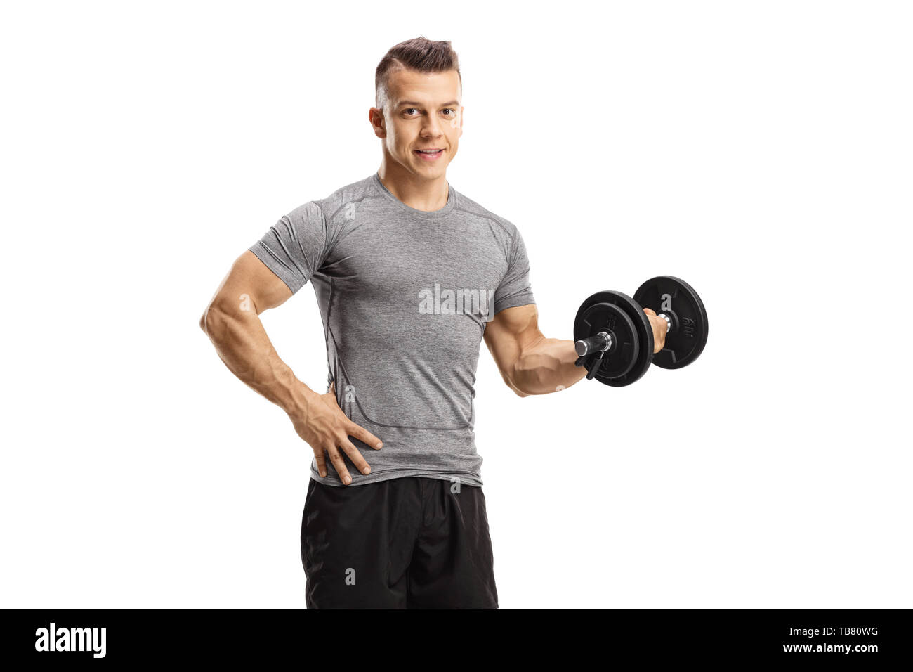 Young man exercising with a dumbbell and looking at the camera isolated on white background Stock Photo