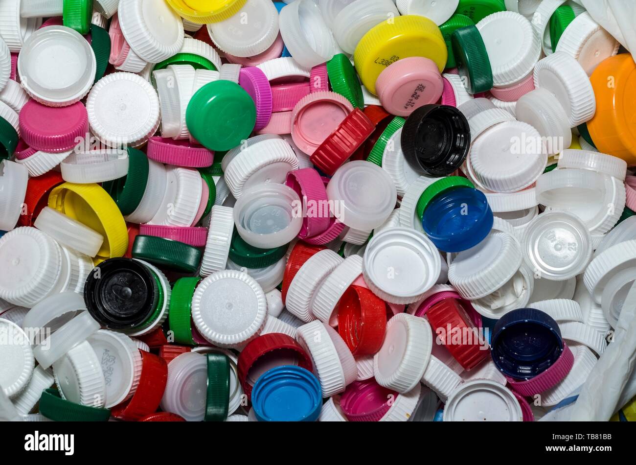 Collection of plastic caps for recycling Stock Photo - Alamy