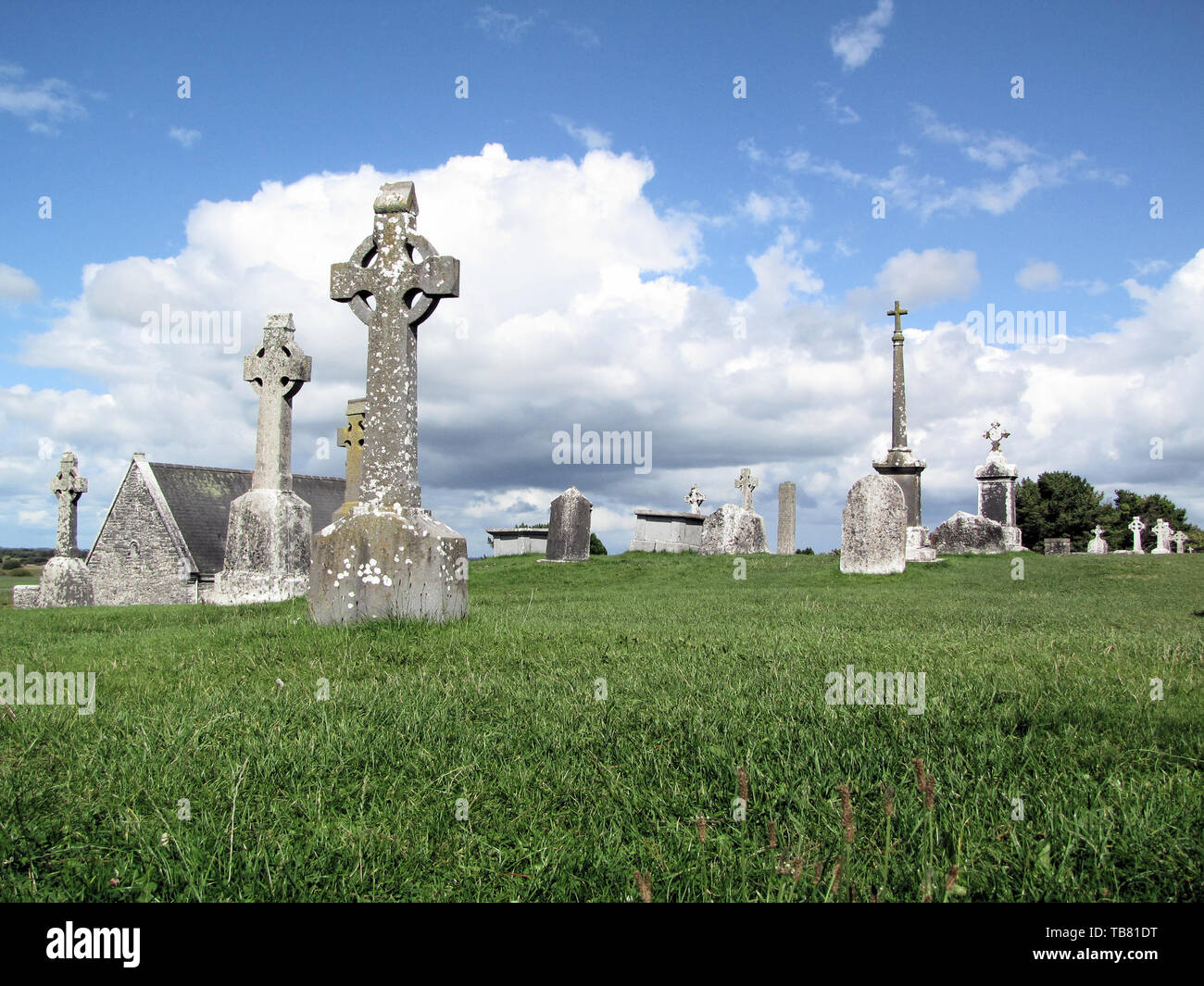Celtic cross and monastic archeological site of Clonmacnoise in Ireland Stock Photo