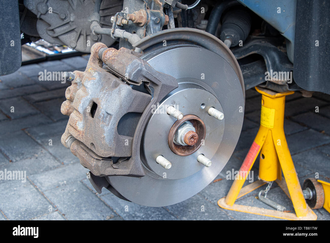 View of new brake discs and pads fitted to a car. Caliper installed Stock  Photo - Alamy