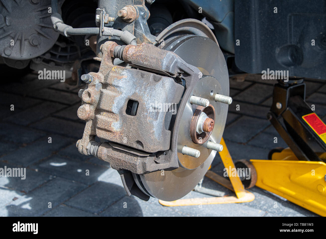 View of new brake discs and pads fitted to a car. Caliper installed Stock  Photo - Alamy