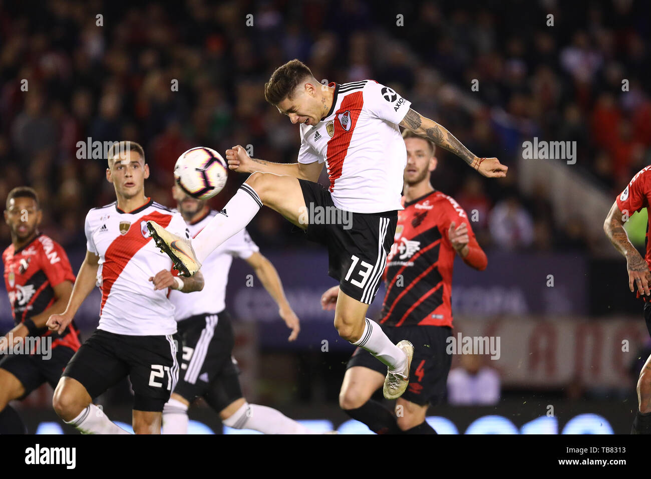 Buenos Aires, Argentina - May 30, 2019: Gonzalo Montiel (River)  fjumps forward for the ball and misses for the finals of the Conmebol Recopa in Bueno Stock Photo