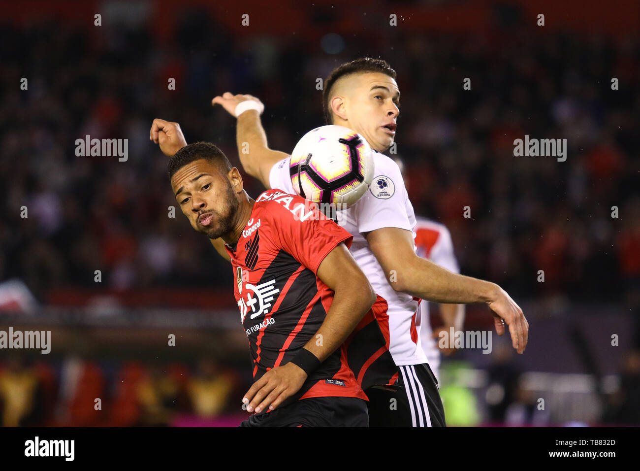 Buenos Aires, Argentina - May 30, 2019: Rafael Borre (River) and Renan  (Paranaense) fighting the possesion of the ball for the finals of the Conmebol Stock Photo