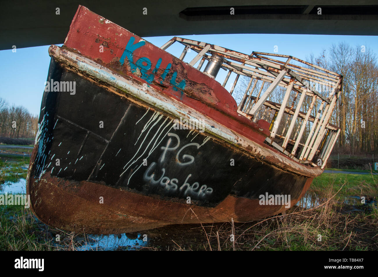 Old Wrecked Boat ashore Stock Photo