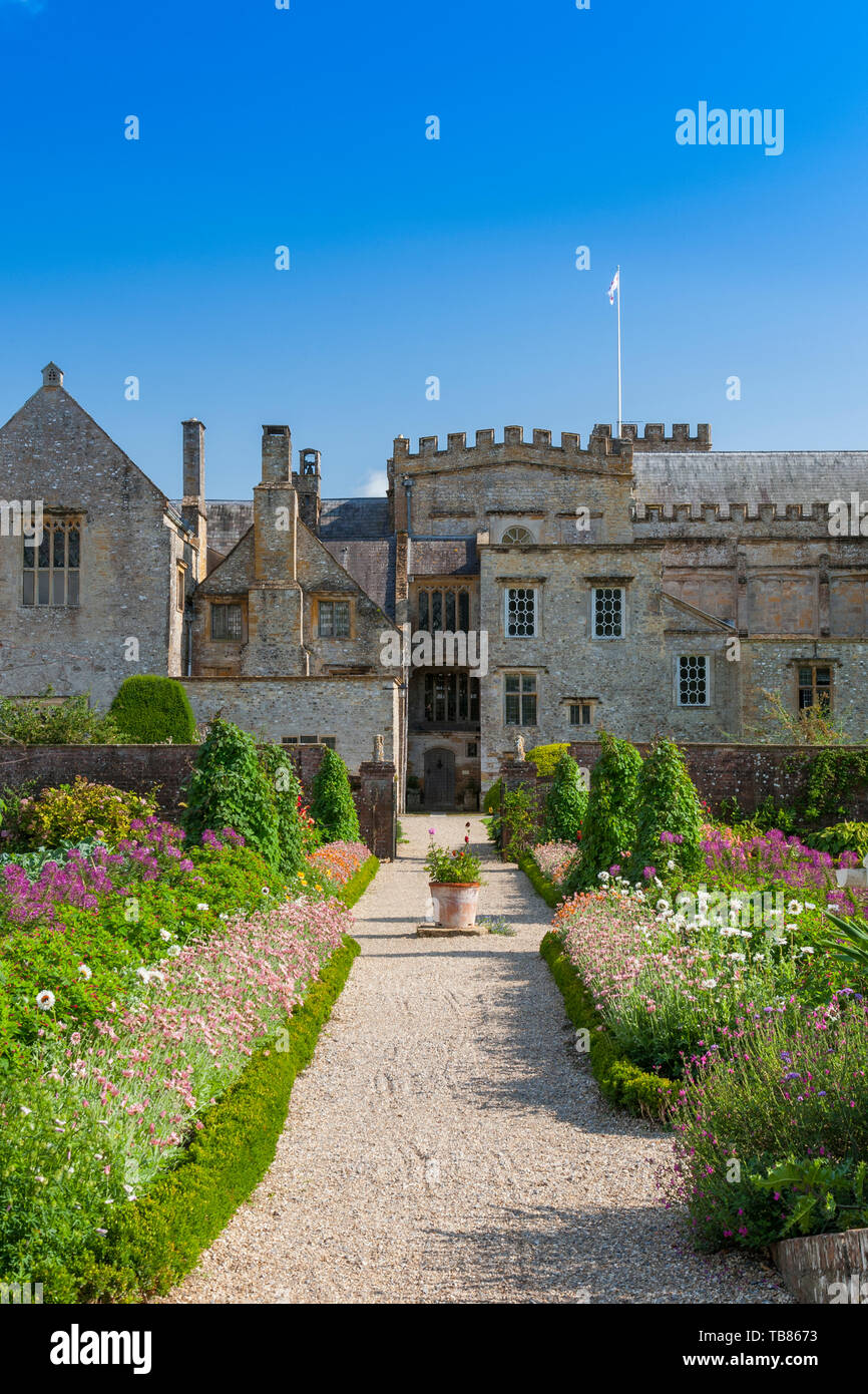 Colourful summer bedding plants surround the vegetable plots in the
