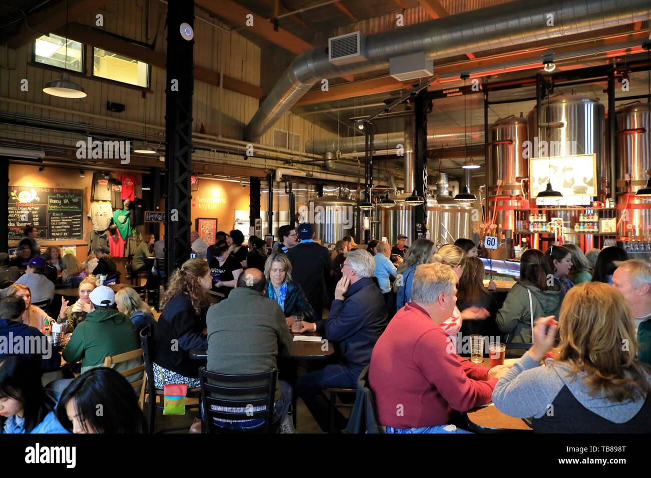 Customers enjoying craft beers in taproom of Urban Growler Brewing Company.Saint Paul.Minnesota.USA Stock Photo