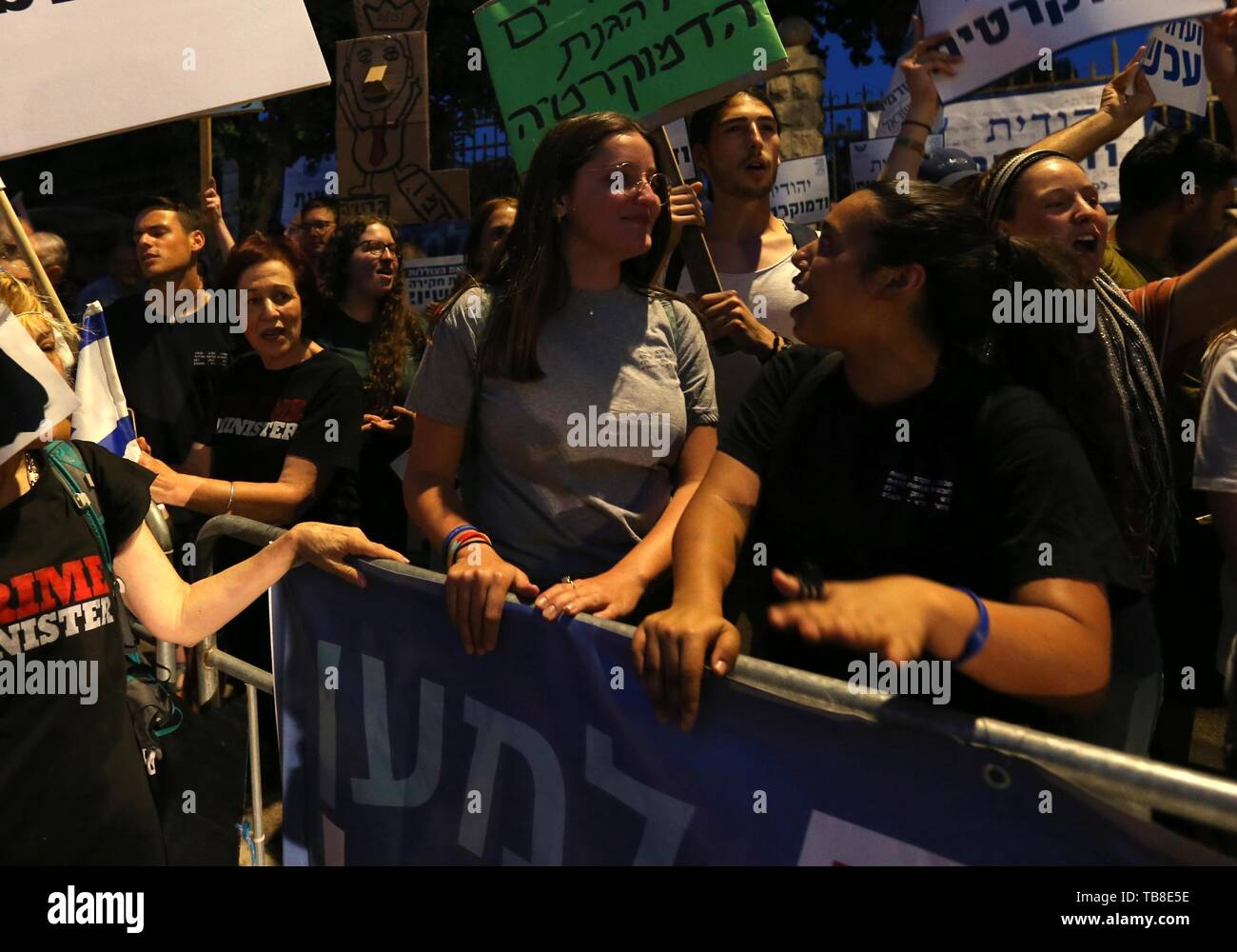 Jerusalem. 30th May, 2019. People chant slogans and hold placards as they take part in a protest against Israeli Prime Minister Benjamin Netanyahu in Jerusalem, on May 30, 2019. Credit: Muammar Awad/Xinhua/Alamy Live News Stock Photo