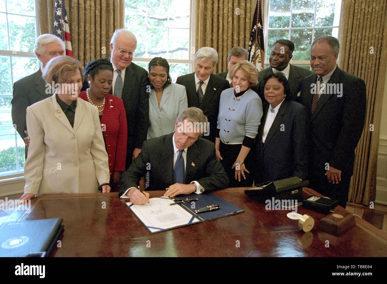 United States President George W. Bush signs the Notification and Federal Employee Anti-discrimination and Retaliation Act in the Oval Office of the White House in Washington, DC, May 15, 2002. Called the 'No Fear' Act, the legislation fights discrimination and retaliation in federal agencies. Standing with the President, from left to right, are: US Representative Connie Morrella (Republican of Maryland; US Senator Thad Cochran (Republican of Mississippi); US Representative Sheila Jackson Lee (Democrat of Texas); US Representative Jim Sensenbrenner (Republican of Wisconsin); Dr. Marsha Coleman Stock Photo