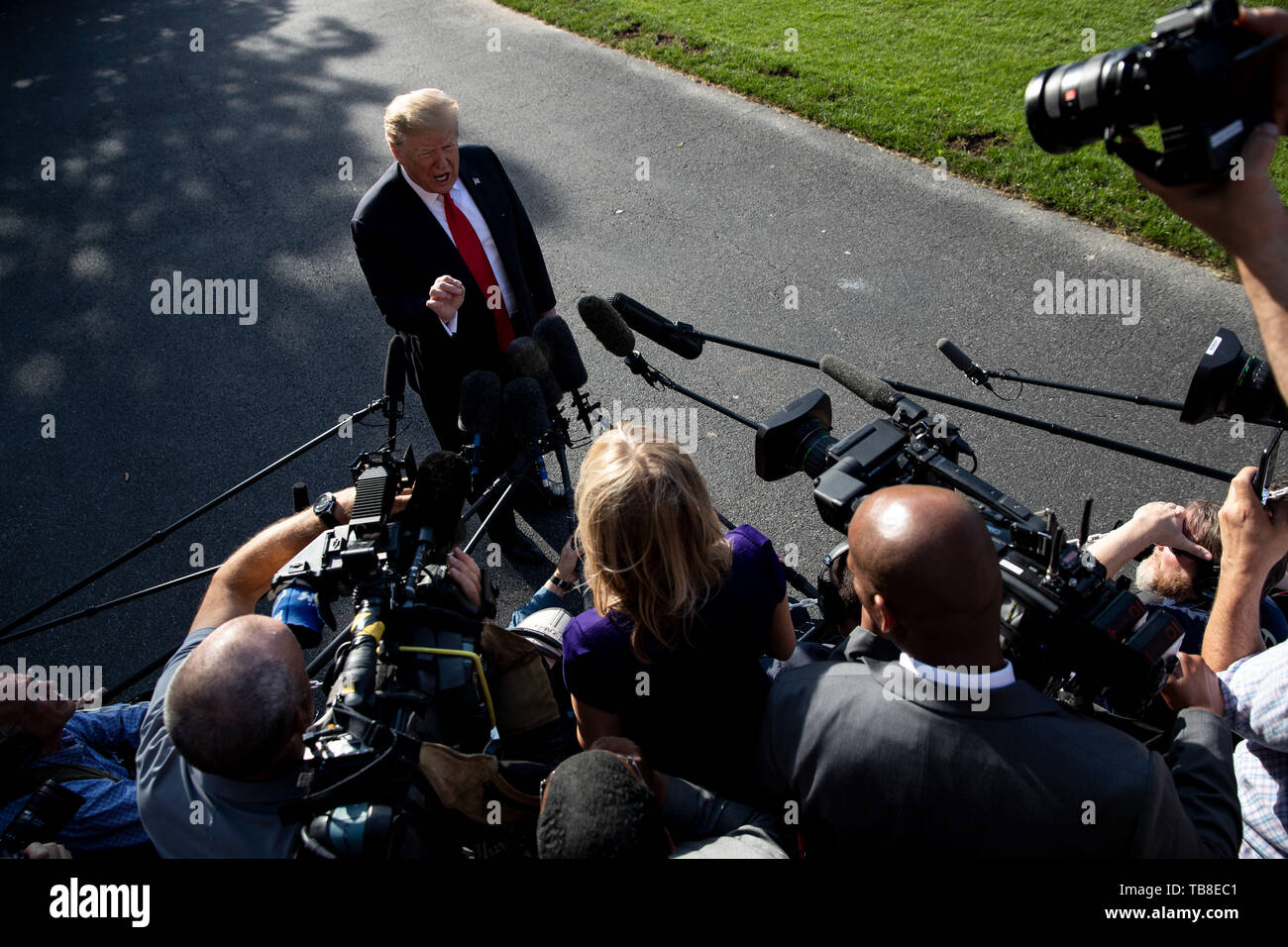 Washington, DC, USA. 30th May, 2019. U.S. President Donald Trump speaks to reporters before leaving the White House in Washington, DC, the United States, on May 30, 2019. Donald Trump slammed Special Counsel Robert Mueller as 'highly conflicted' on Thursday, one day after Mueller's first-ever public statement saying that charging Trump with a crime was 'not an option we could consider' due to Justice Department guidelines. Credit: Ting Shen/Xinhua/Alamy Live News Stock Photo