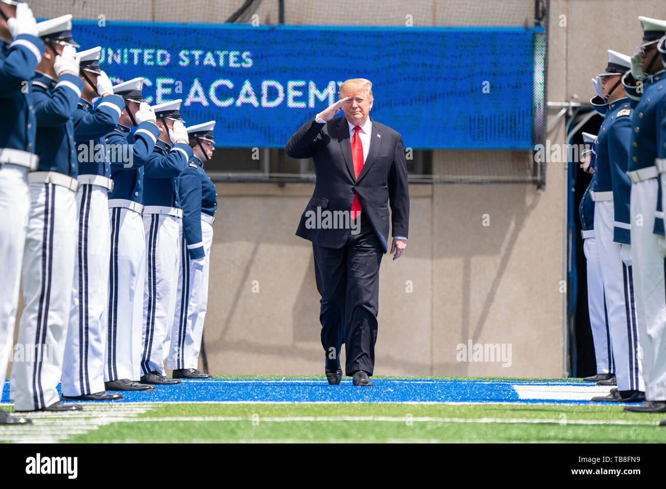 U.S President Donald Trump salutes as he walks past the honor guard on arrival for the the U.S. Air Force Academy Graduation Ceremony at the USAF Academy Falcon Stadium May 30, 2019 in Colorado Springs, Colorado. Credit: Planetpix/Alamy Live News Stock Photo