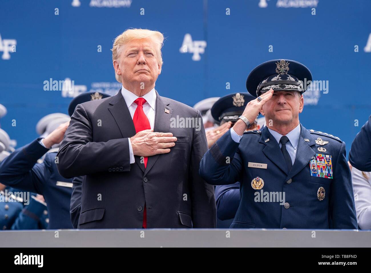 U.S President Donald Trump stands with Air Force Chief of Staff Gen. David Goldfein for the national anthem during the U.S. Air Force Academy Graduation Ceremony at the USAF Academy Falcon Stadium May 30, 2019 in Colorado Springs, Colorado. Credit: Planetpix/Alamy Live News Stock Photo