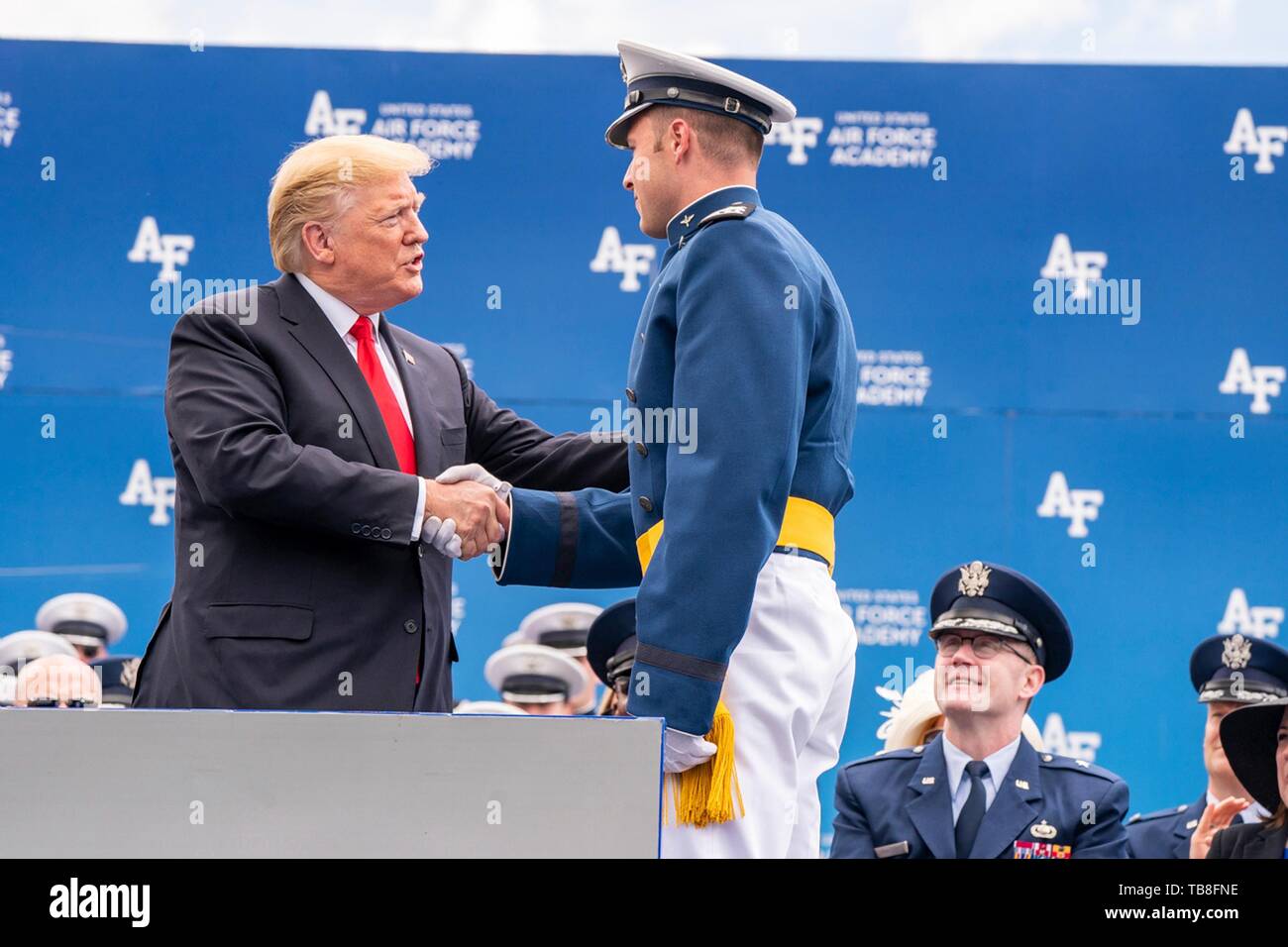 U.S President Donald Trump congratulates cadet Nic Ready on stage at the U.S. Air Force Academy Graduation Ceremony at the USAF Academy Falcon Stadium May 30, 2019 in Colorado Springs, Colorado. Cadet Ready is the college baseball homerun derby winner. Credit: Planetpix/Alamy Live News Stock Photo