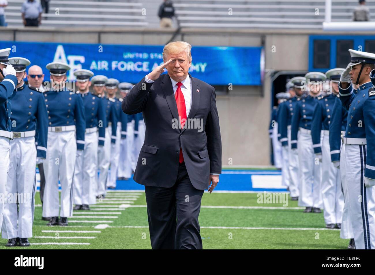 U.S President Donald Trump salutes as he walks past the honor guard on arrival for the the U.S. Air Force Academy Graduation Ceremony at the USAF Academy Falcon Stadium May 30, 2019 in Colorado Springs, Colorado. Credit: Planetpix/Alamy Live News Stock Photo