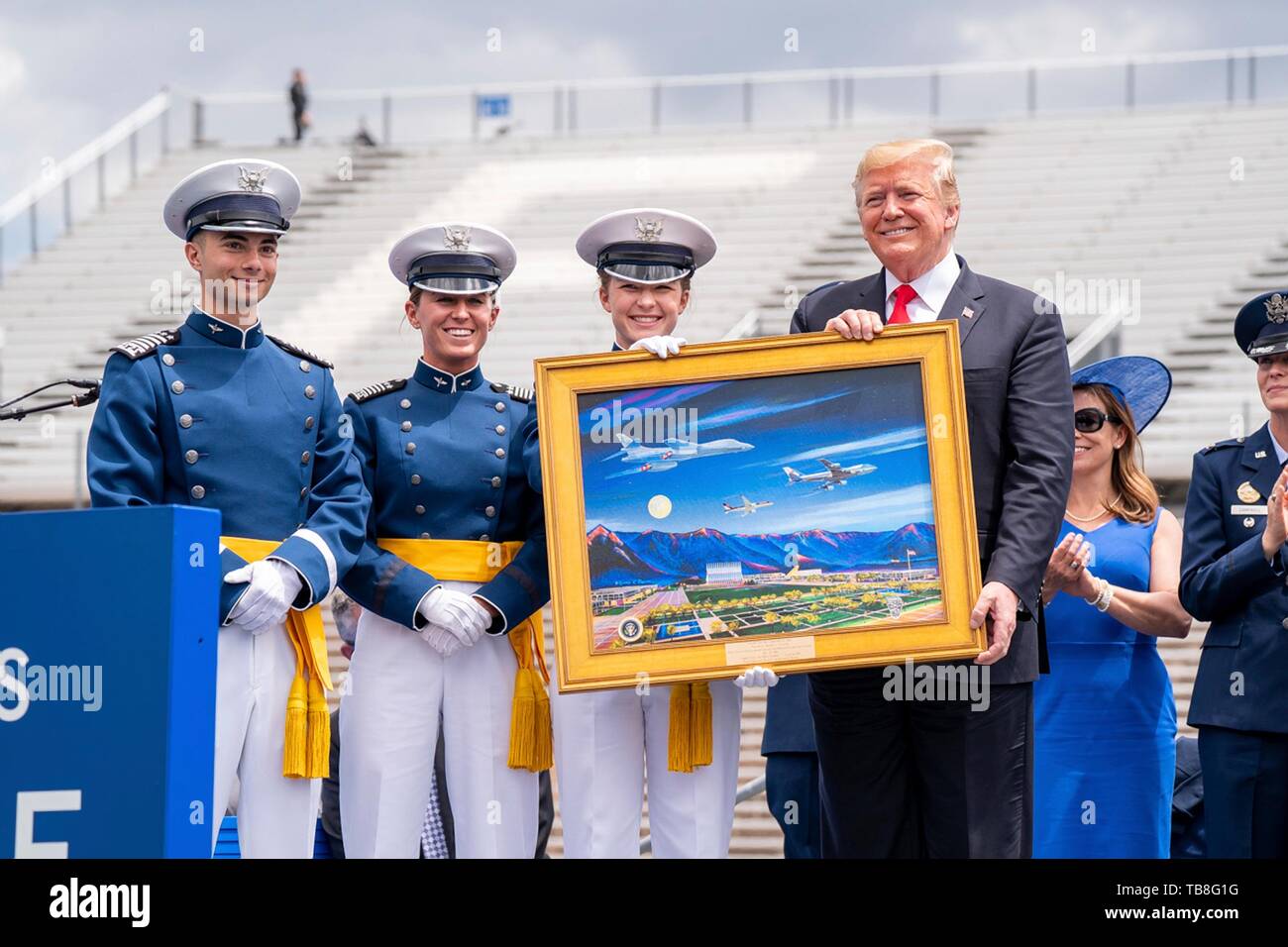 U.S President Donald Trump is presented with a painting by cadets during the U.S. Air Force Academy Graduation Ceremony at the USAF Academy Falcon Stadium May 30, 2019 in Colorado Springs, Colorado. Credit: Planetpix/Alamy Live News Stock Photo
