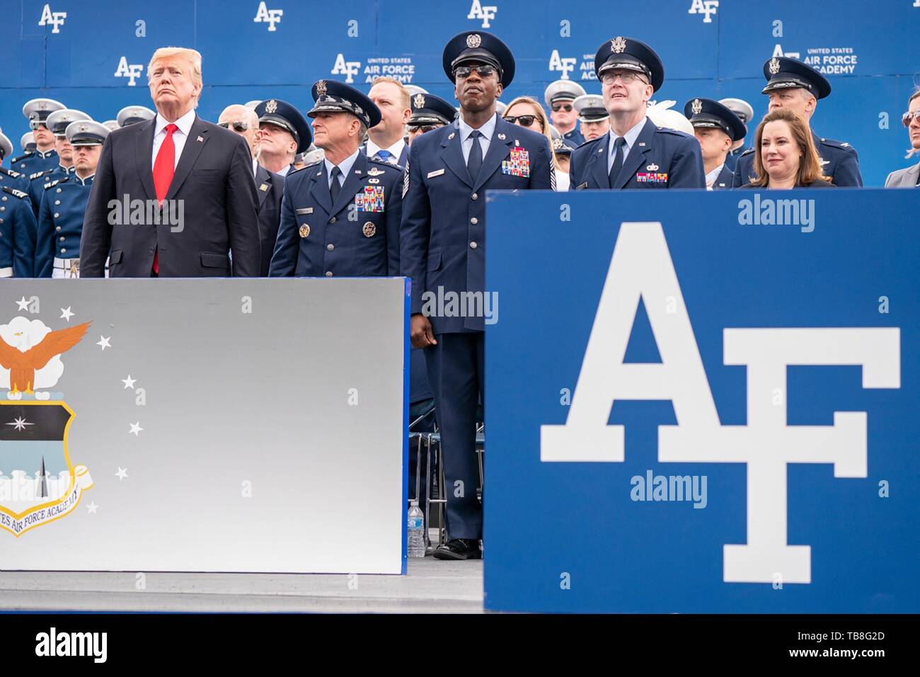 U.S President Donald Trump stands with Air Force officers as they watch the Air Force Air Demonstration Squadron Thunderbirds perform a flyby marking the end of the U.S. Air Force Academy Graduation Ceremony at the USAF Academy Falcon Stadium May 30, 2019 in Colorado Springs, Colorado. Credit: Planetpix/Alamy Live News Stock Photo