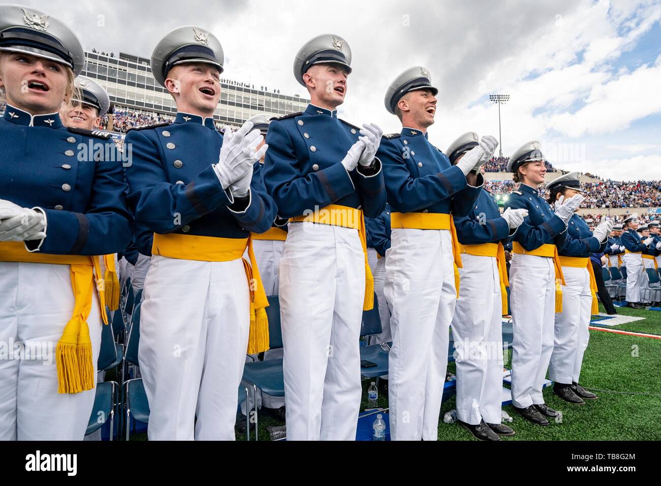 U.S. Air Force Academy cadets applaud at the conclusion of graduation ceremonies at the USAF Academy Falcon Stadium May 30, 2019 in Colorado Springs, Colorado. U.S. President Donald Trump gave the commencement address to the more than 900 graduates. Credit: Planetpix/Alamy Live News Stock Photo