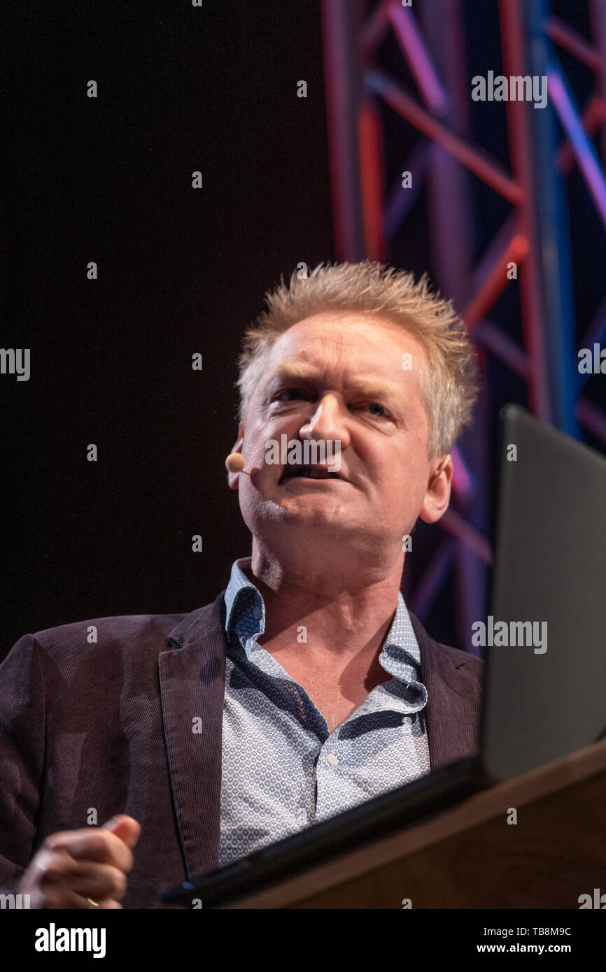 The Hay Festival, Hay on Wye, Wales UK , Friday 31st May 2019.  Giles Milton, military historian, talking about and reading selections from his book ‘D Day: The Soldiers’ Story’, on stage at  the 2019 Hay Festival   The festival, now in its 32nd year, held annually in the small town of Hay on Wye on the Wales - England border,  attracts the finest writers, politicians and intellectuals from  across the globe for 10 days of talks and discussions, celebrating the best of the written word and critical debate  Photo © Keith Morris / Alamy Live News Stock Photo
