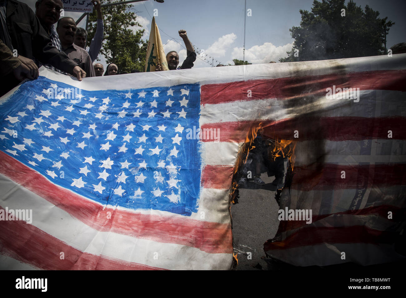 Tehran, Tehran, Iran. 31st May, 2019. Iranians burn US flag, during an anti-Israel rally marking Al Quds Day (Jerusalem Day), in support of Palestinian resistance against Israeli in Tehran, Iran. Each year Iran marks the last Friday of the fasting month of Ramadan as a solidarity day with the Palestinians. Credit: Rouzbeh Fouladi/ZUMA Wire/Alamy Live News Stock Photo