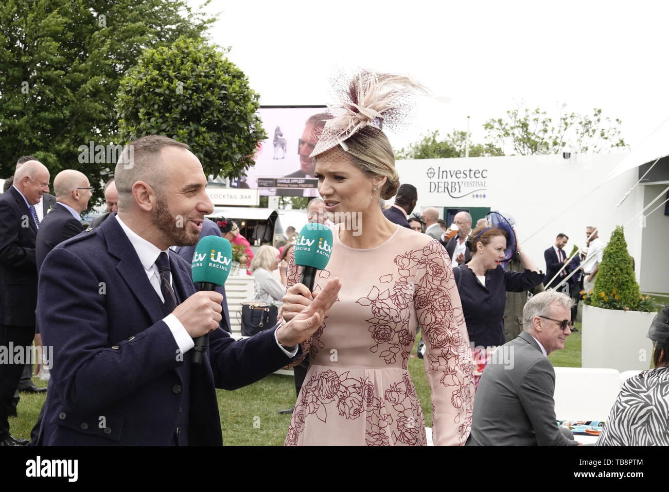 Epsom Downs, Surrey, UK. 31st May, 2019. ITV's Charlotte Hawkins and Mark Hayes on camera prior to the start of racing at the Investec Derby Festival - on Ladies Day, classic horse race. Credit: Motofoto/Alamy Live News Stock Photo