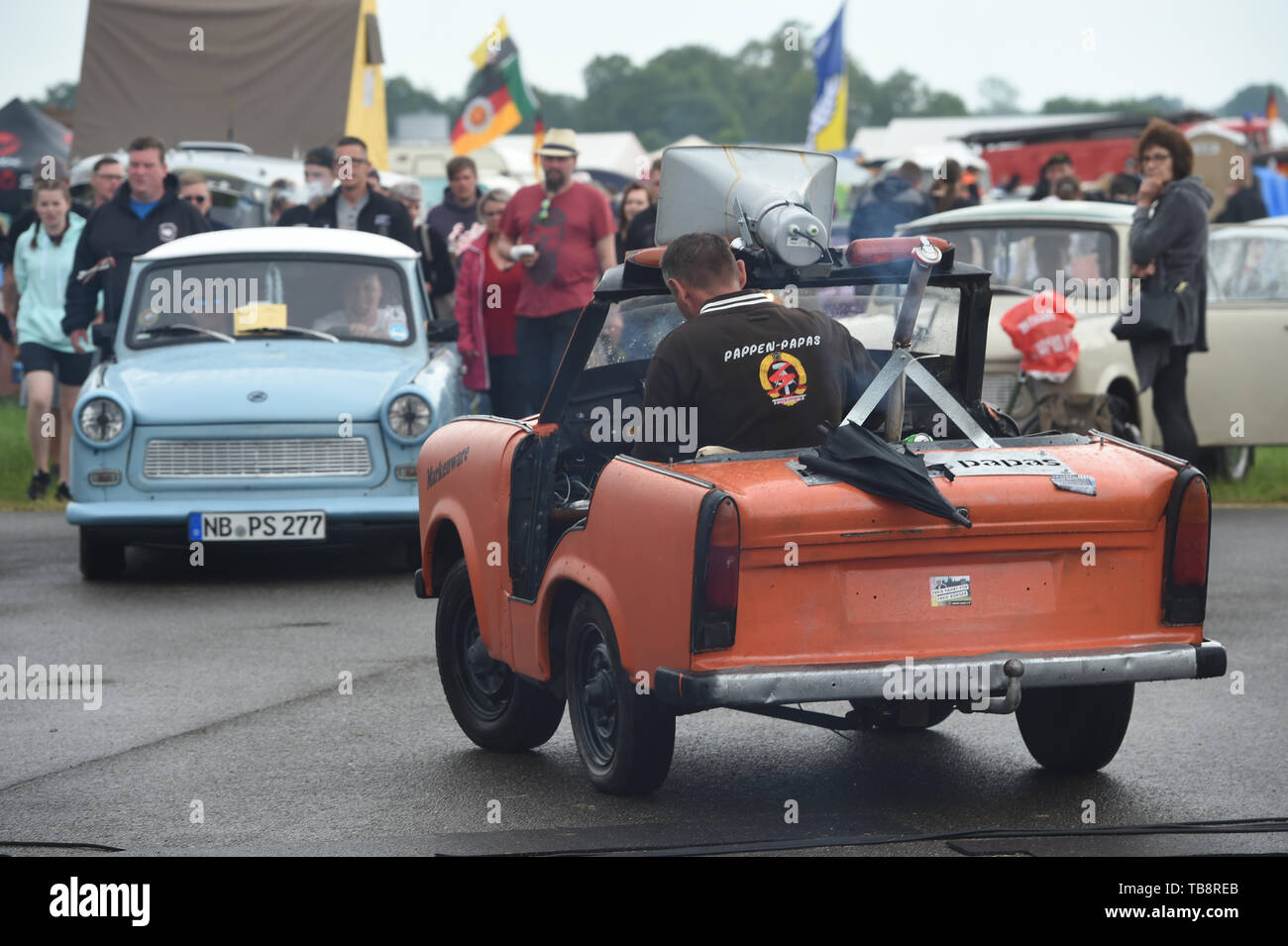 Anklam, Germany. 31st May, 2019. A GDR-produced Trabant converted into a cabriolet is driving on the grounds of the 25th International Trabi Meeting at the airfield. About 800 registered vehicles and about 1400 lovers of the cult vehicle from GDR times will meet in the Peenestadt until 02.06.2019. Over 800 vehicles from all over Germany, Poland, Hungary and Bulgaria as well as Norway, the Netherlands and France have registered for the meeting. Credit: Stefan Sauer/dpa-Zentralbild/dpa/Alamy Live News Stock Photo