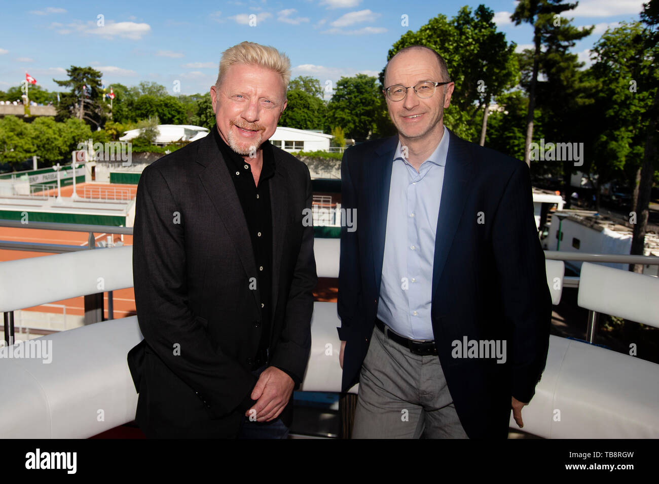 31 May 2019, France (France), Paris: Tennis: Grand Slam/ATP-Tour, French  Open: The three-time Wimbledon winner Boris Becker (l) as commentator  stands together with Eurosport presenter Matthias Stach in the TV studio.  Photo: