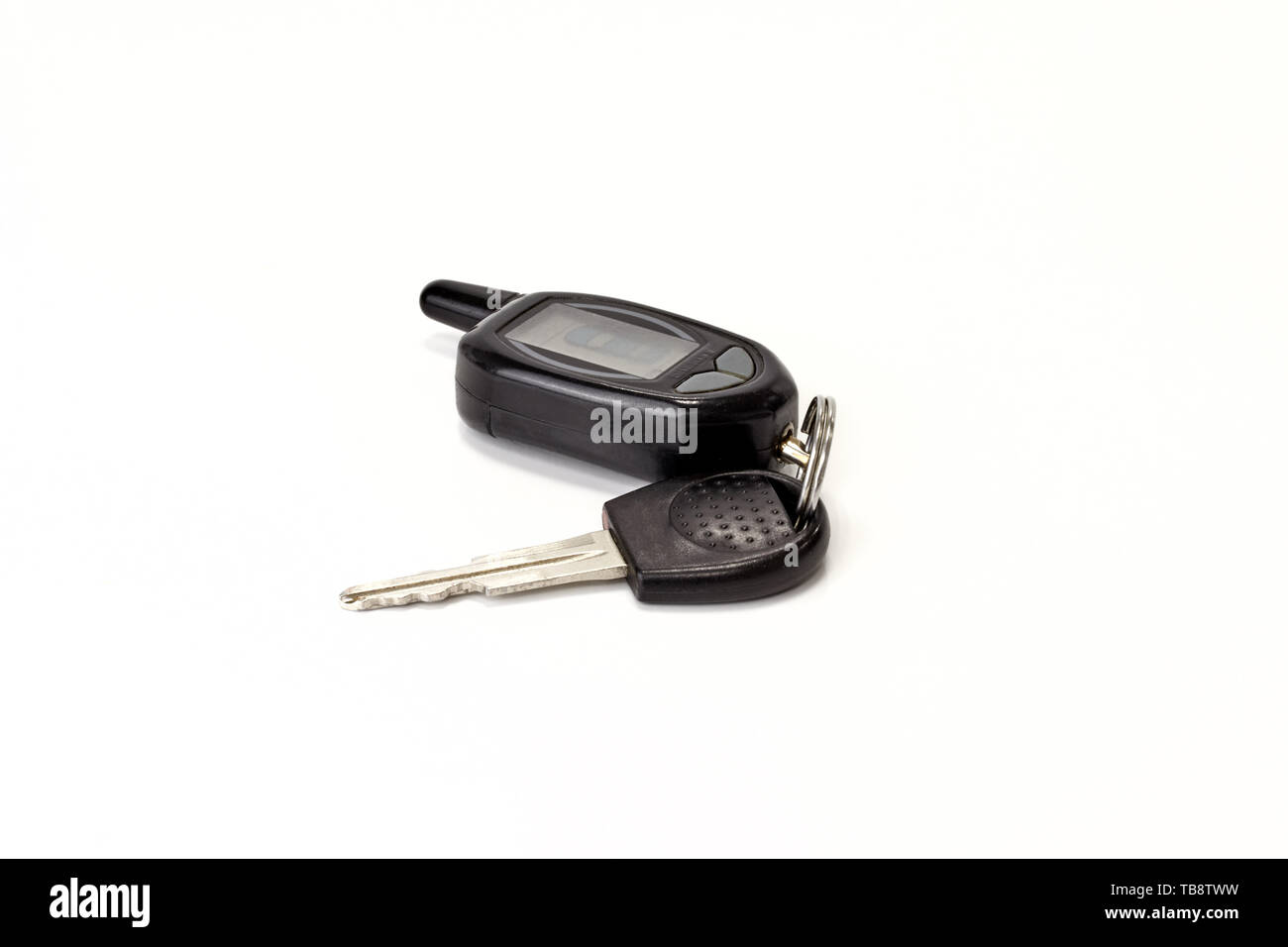 car keys with remote control from alarm system on white background
