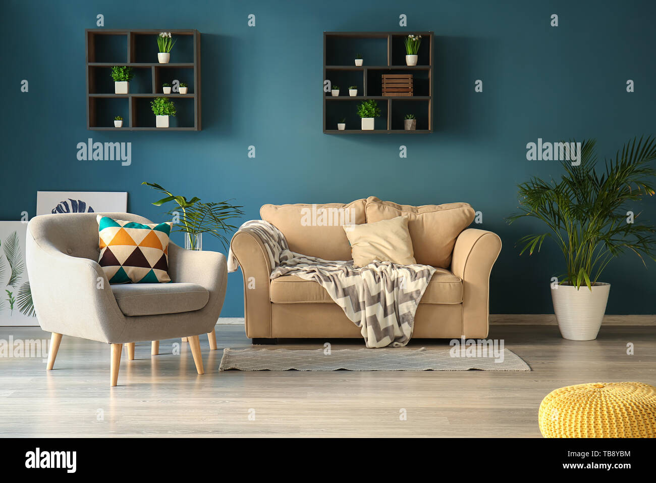Interior of modern room with comfortable sofa and armchair Stock Photo ...